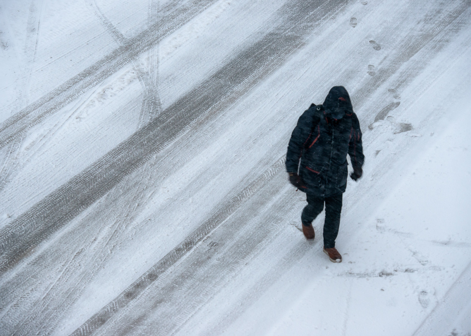 Man waling in snowstorm